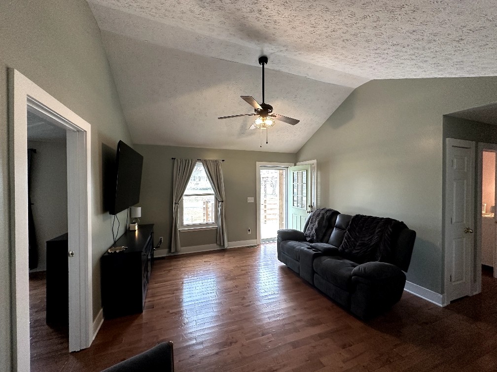 882 Pleasant Hill Road Franklin, KY 42134 - Photo 4 of 16 a living room with furniture and a fireplace