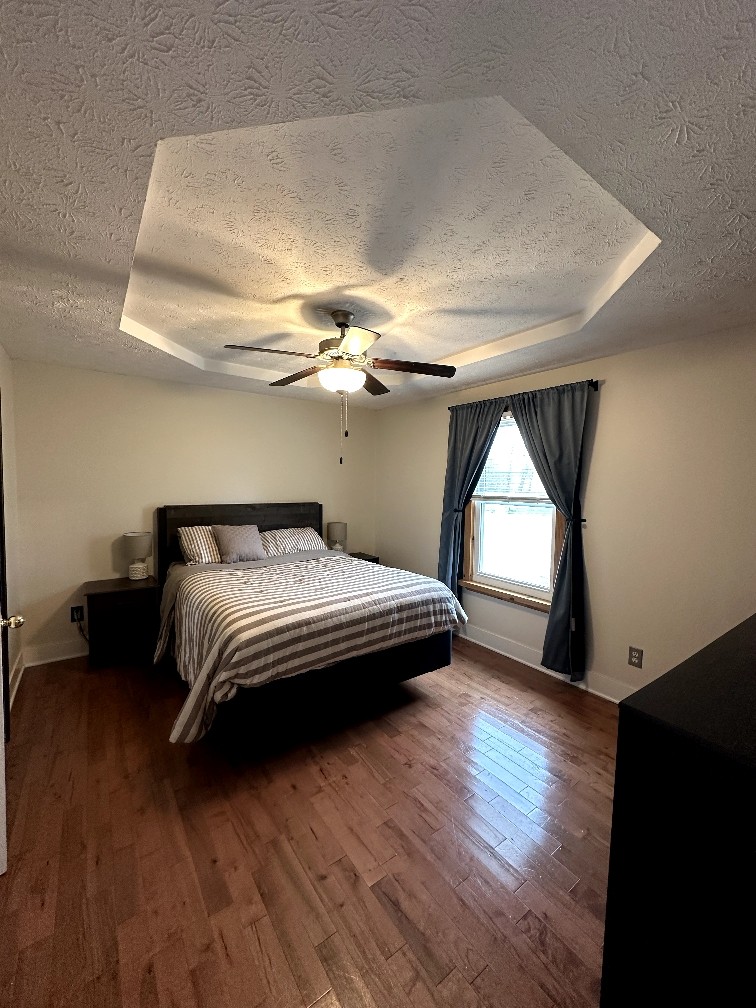 882 Pleasant Hill Road Franklin, KY 42134 - Photo 10 of 16 a bedroom with a bed and a window