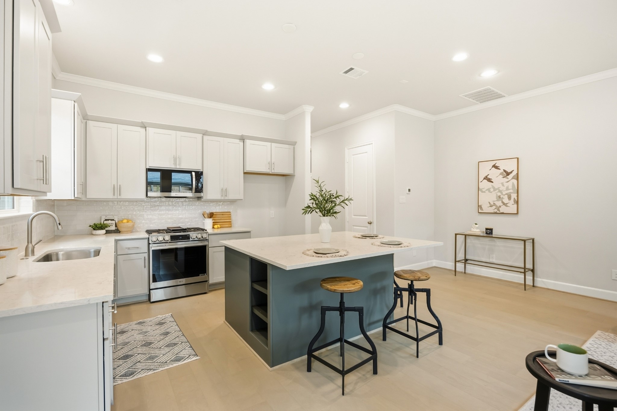 4317 Roseland Street, Unit B Houston, TX 77006 - Photo 5 of 29 Comfort meets chic: Dive into this spacious kitchen's inviting island that’s perfect for brunch, buffets, and big laughs with loved ones.