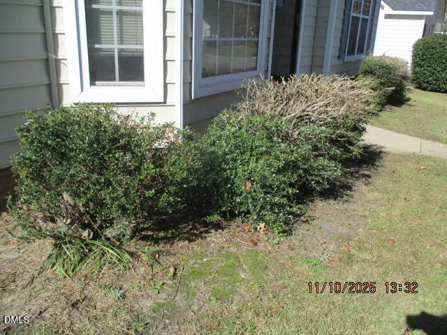 a view of a backyard of the house