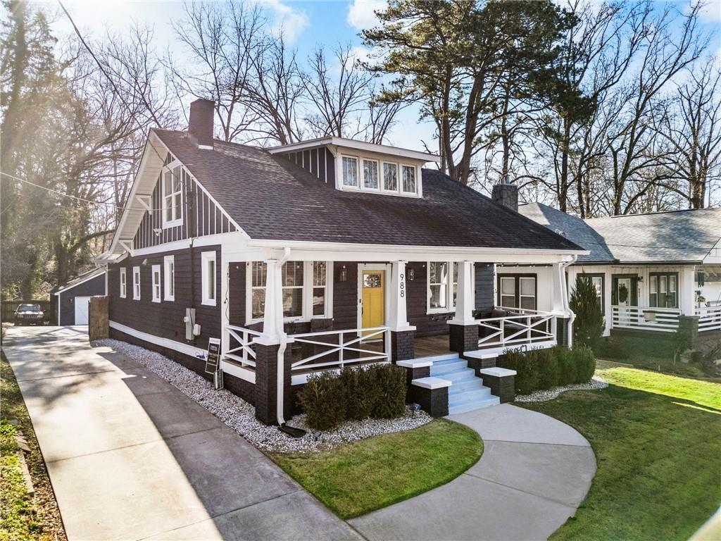 a front view of a house with yard porch and seating