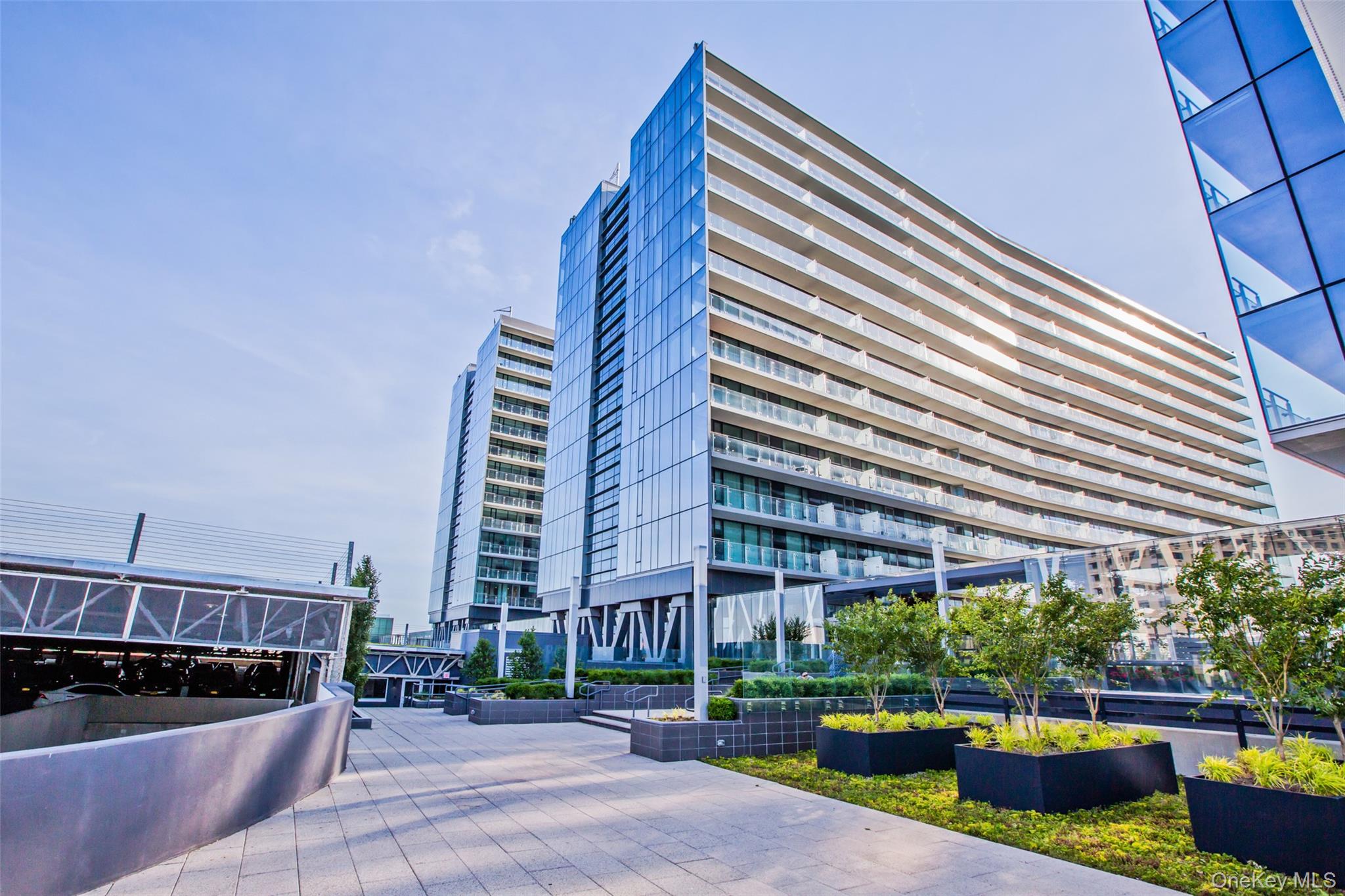131-03 40 Road, Unit PH1Y Queens, NY 11354 - Photo 1 of 13 a view of a tall building from the roof deck