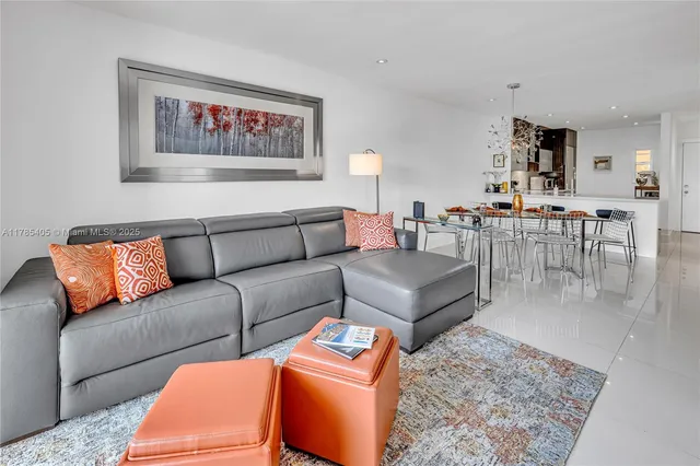 a living room with furniture or couch and a dining table