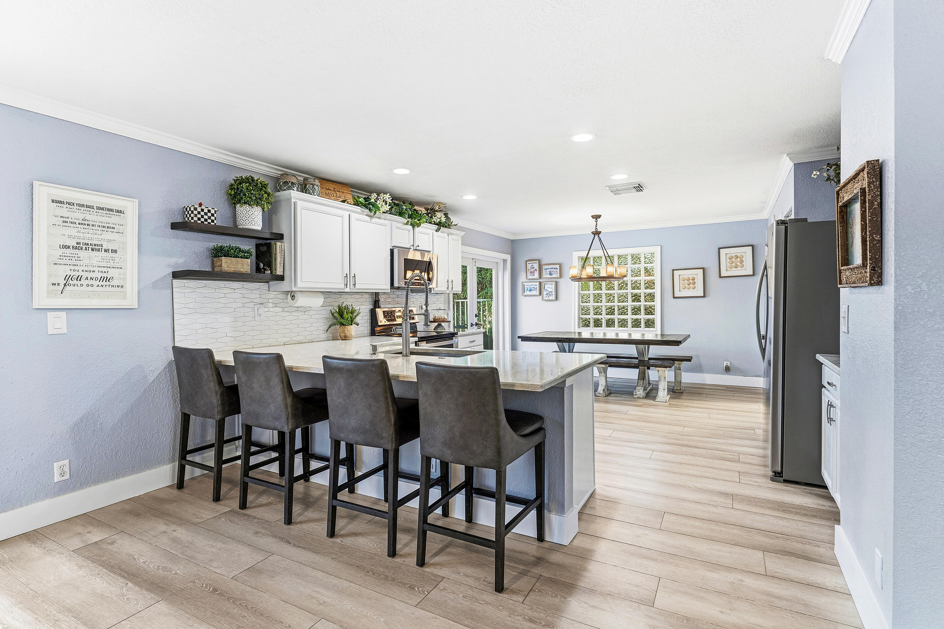 1135 Rialto Drive Boynton Beach, FL 33436 - Photo 8 of 54 a view of a dining room with furniture and wooden floor