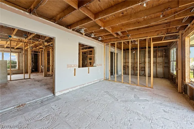 a view of a house with swimming pool and sitting area