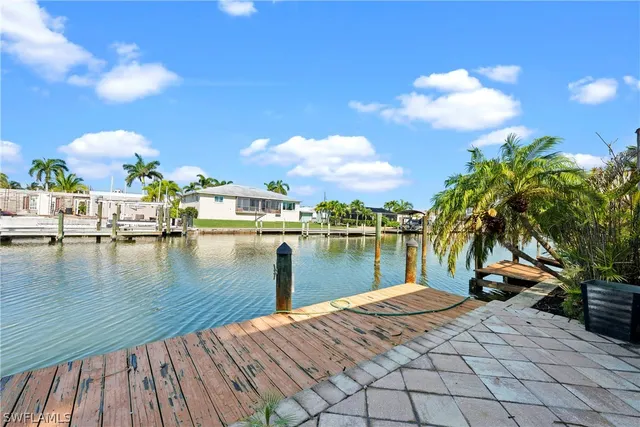 a view of a hallway with wooden walls