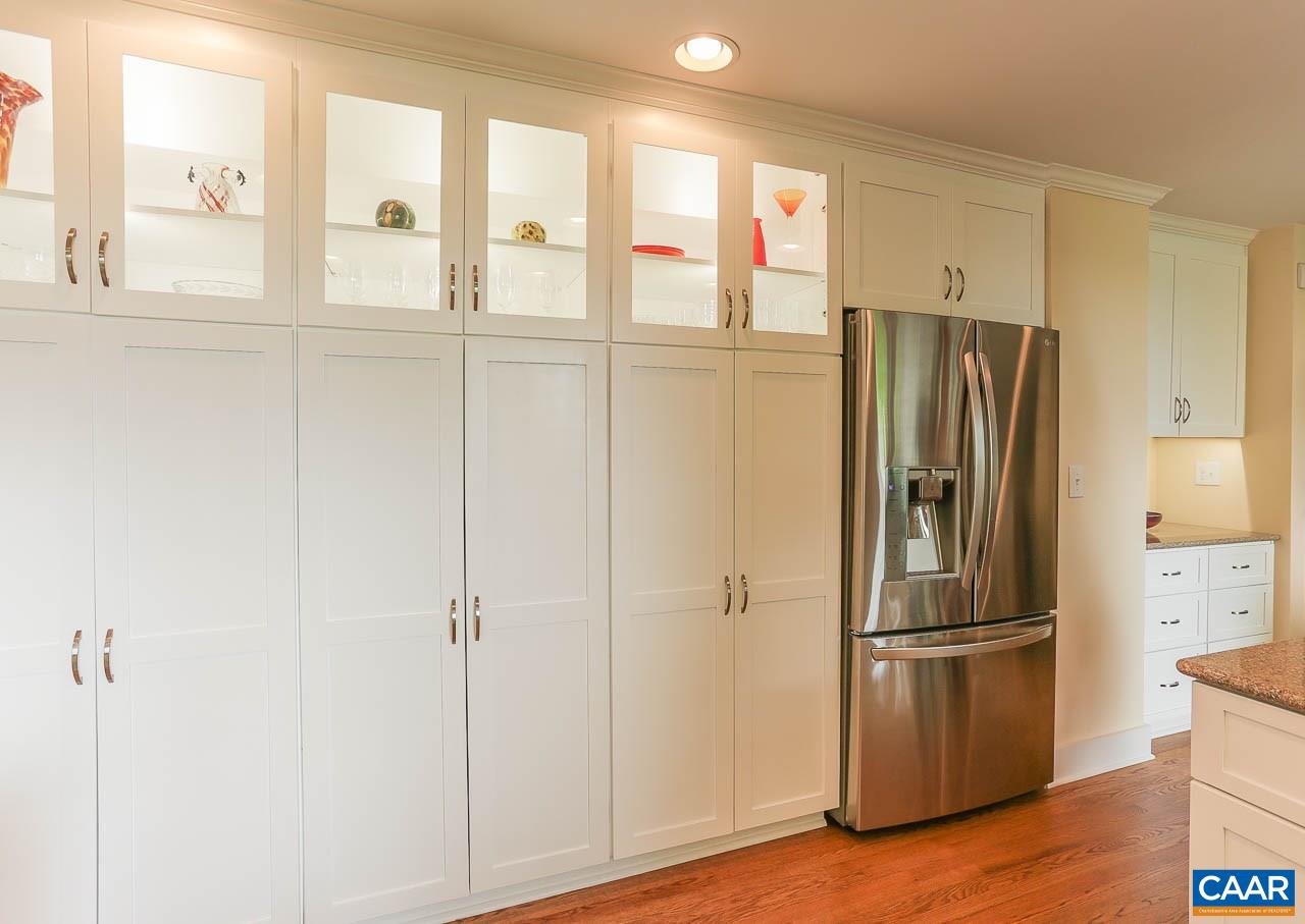 590 Explorers Road Charlottesville, VA 22911 - Photo 13 of 50 a view of a kitchen with a refrigerator and wooden floor