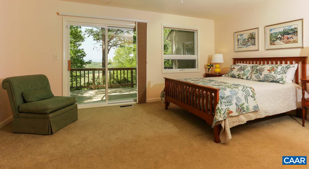 590 Explorers Road Charlottesville, VA 22911 - Photo 14 of 50 a bedroom with a bed couch and a window