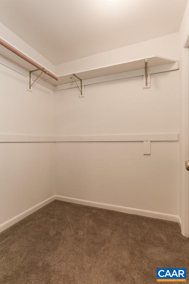 590 Explorers Road Charlottesville, VA 22911 - Photo 16 of 50 a view of a room with racks on the wall