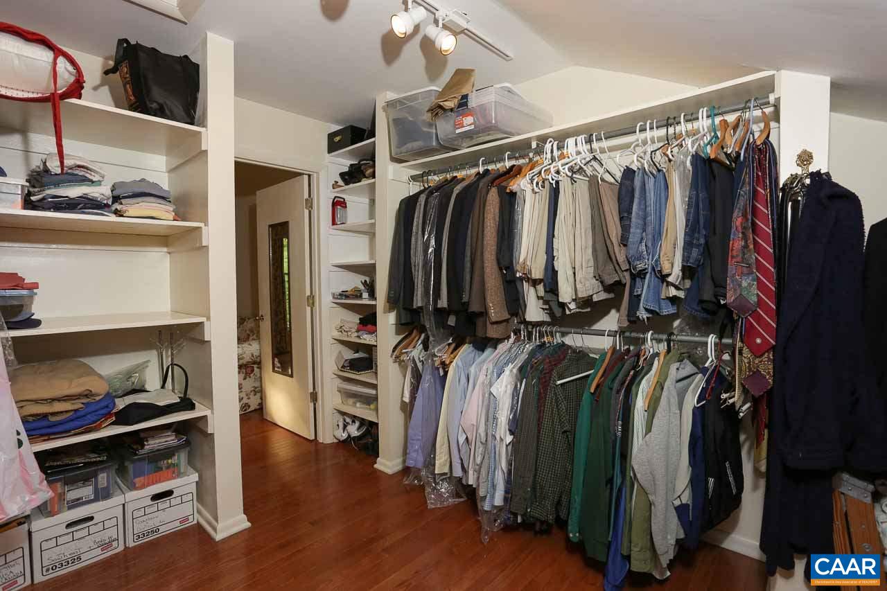 590 Explorers Road Charlottesville, VA 22911 - Photo 22 of 50 a view of walk in closet with clothes and shoes