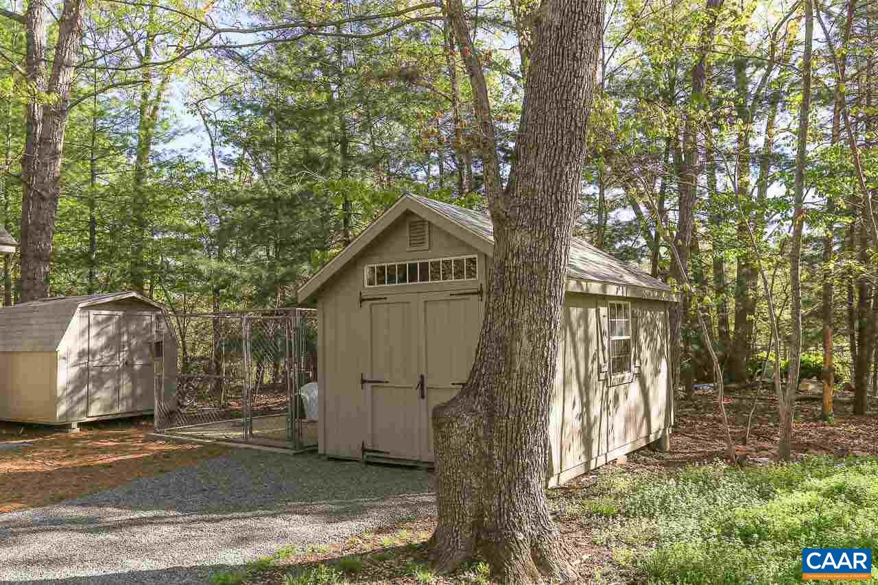 590 Explorers Road Charlottesville, VA 22911 - Photo 36 of 50 a view of backyard of house with wooden fence and large trees