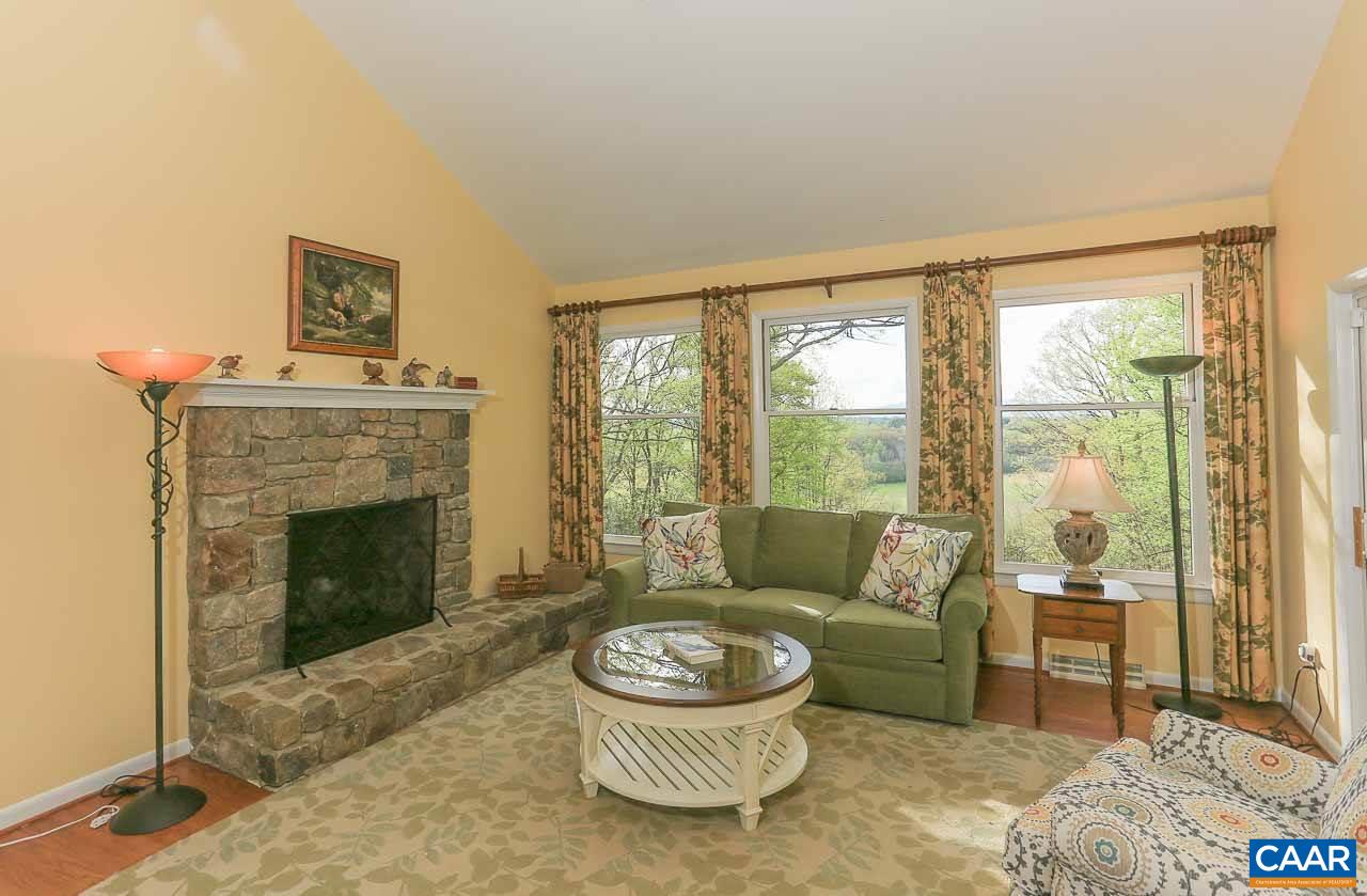 590 Explorers Road Charlottesville, VA 22911 - Photo 4 of 50 a living room with furniture a window and a fireplace