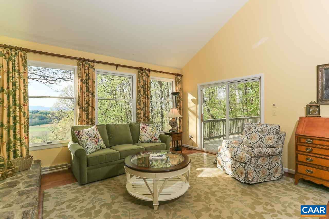 590 Explorers Road Charlottesville, VA 22911 - Photo 5 of 50 a living room with furniture and a large window
