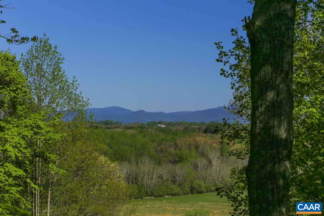 590 Explorers Road Charlottesville, VA 22911 - Photo 7 of 50 a view of a lake with mountains in the background