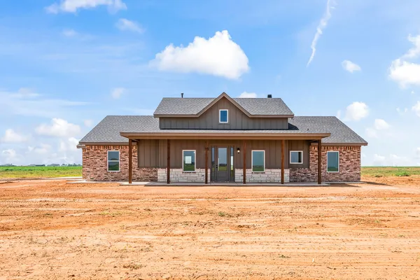 a front view of a house with a ocean view