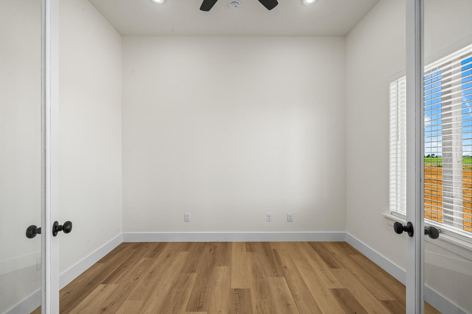 8115 County Road Shallowater, TX 79363 - Photo 15 of 47 a view of a room that has wooden floor in it