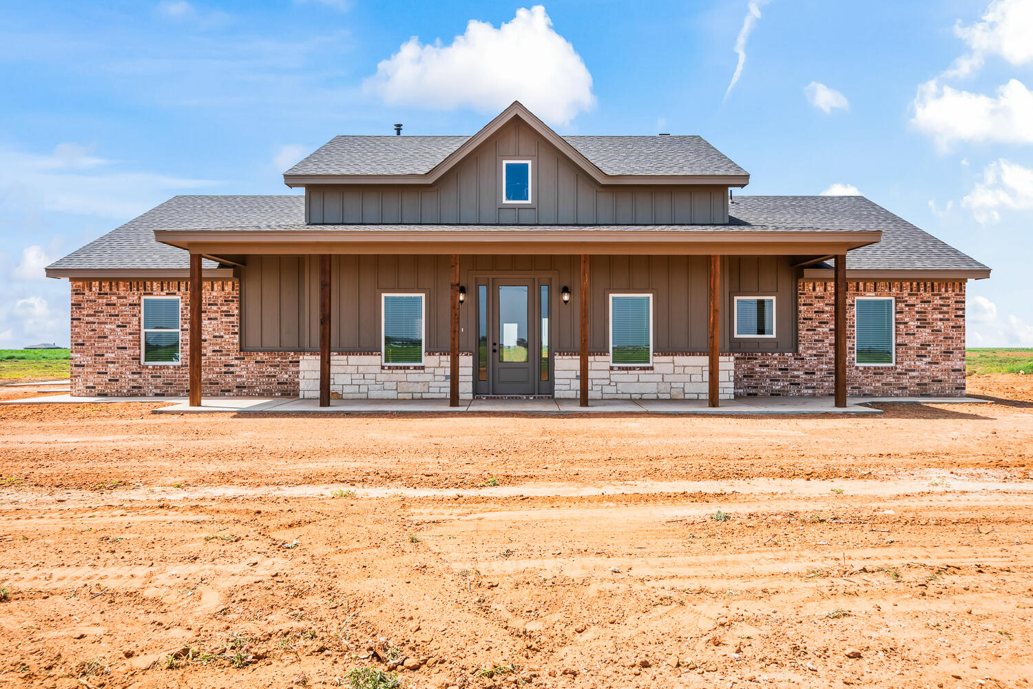 8115 County Road Shallowater, TX 79363 - Photo 2 of 47 a view of a brick house with large windows