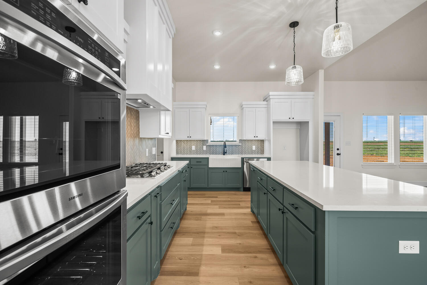 8115 County Road Shallowater, TX 79363 - Photo 25 of 47 a large kitchen with stainless steel appliances kitchen island a large counter tops a stove a sink and a refrigerator