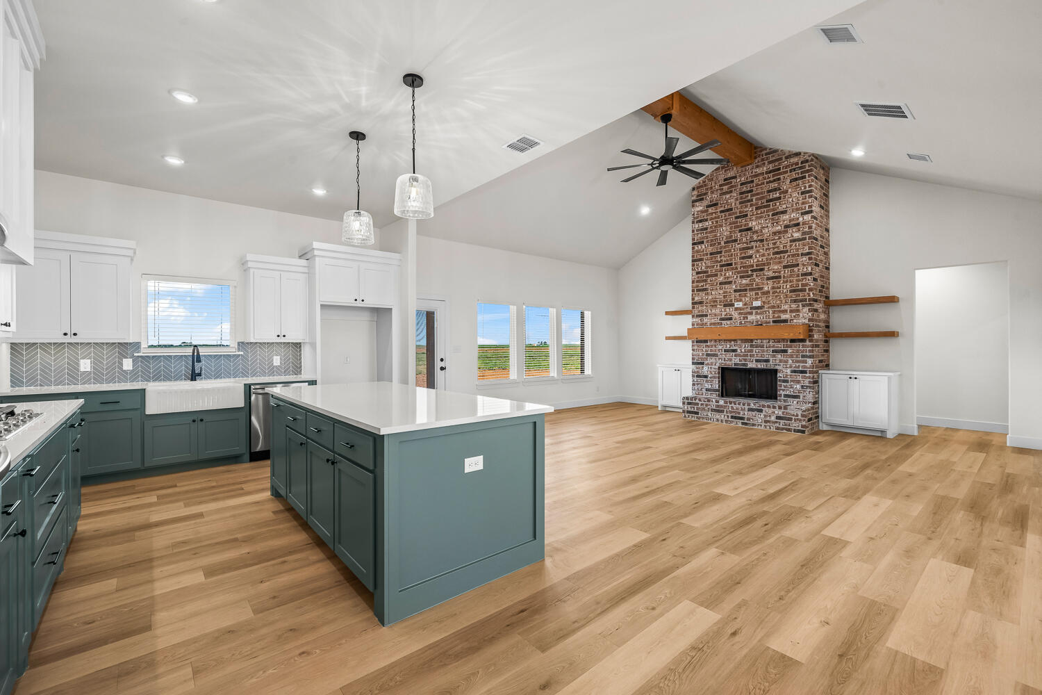8115 County Road Shallowater, TX 79363 - Photo 26 of 47 a kitchen with kitchen island granite countertop a sink counter top space and cabinets