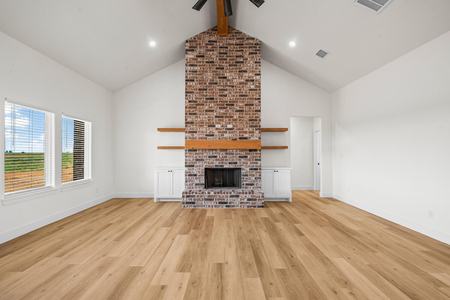8115 County Road Shallowater, TX 79363 - Photo 28 of 47 a view of a livingroom with a fireplace and window