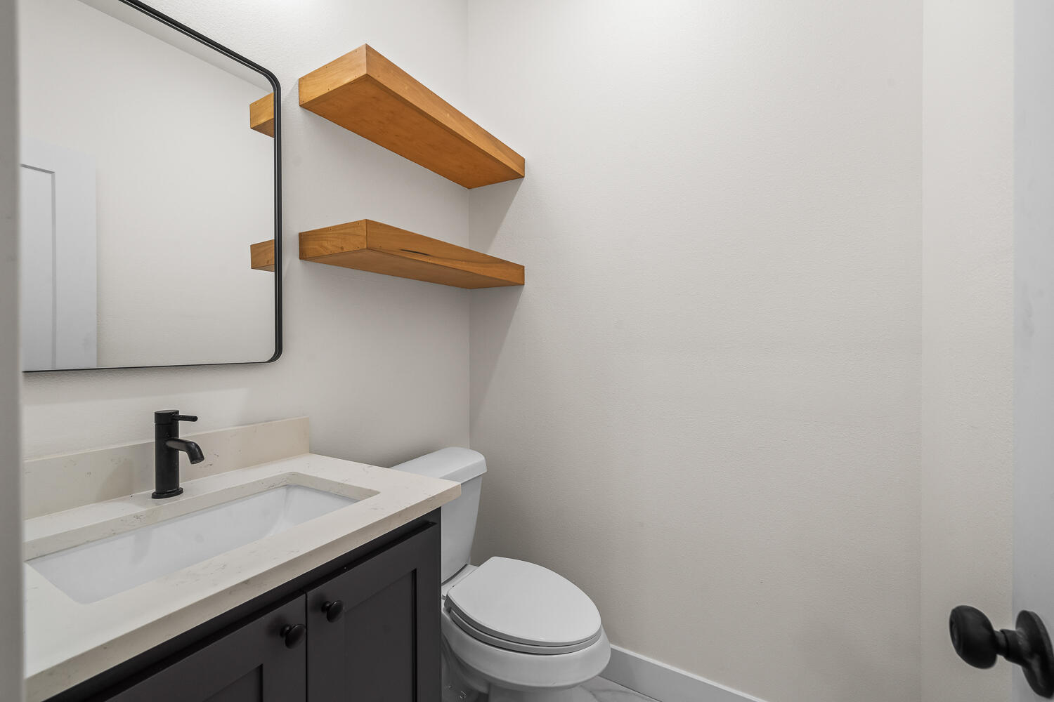 8115 County Road Shallowater, TX 79363 - Photo 32 of 47 a bathroom with a sink a toilet and mirror