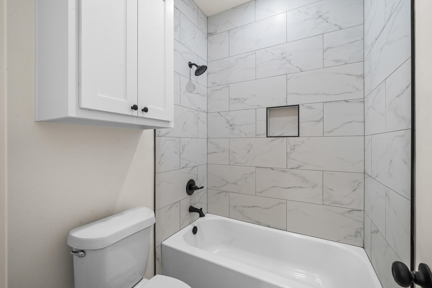 8115 County Road Shallowater, TX 79363 - Photo 35 of 47 a bathroom with a bathtub and a toilet