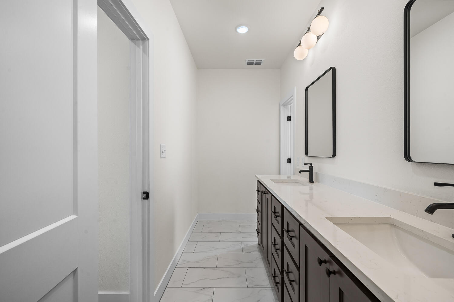 8115 County Road Shallowater, TX 79363 - Photo 36 of 47 a bathroom with 2 sink and a mirror