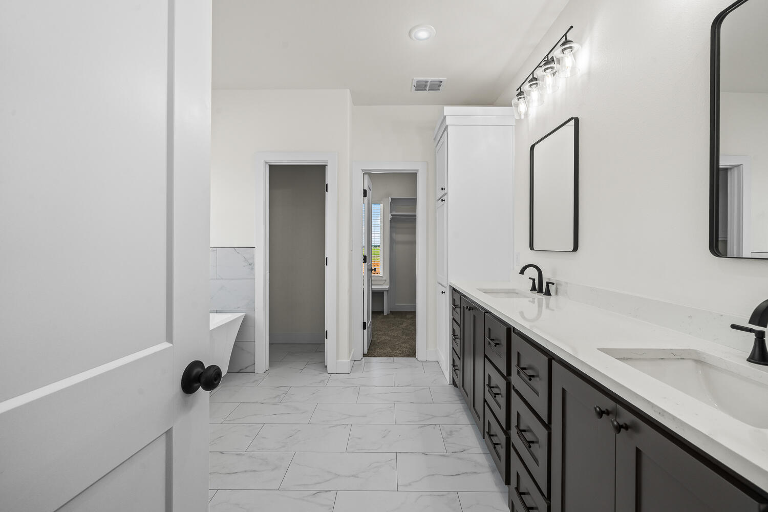 8115 County Road Shallowater, TX 79363 - Photo 7 of 47 a bathroom with a double vanity sink a toilet and a mirror