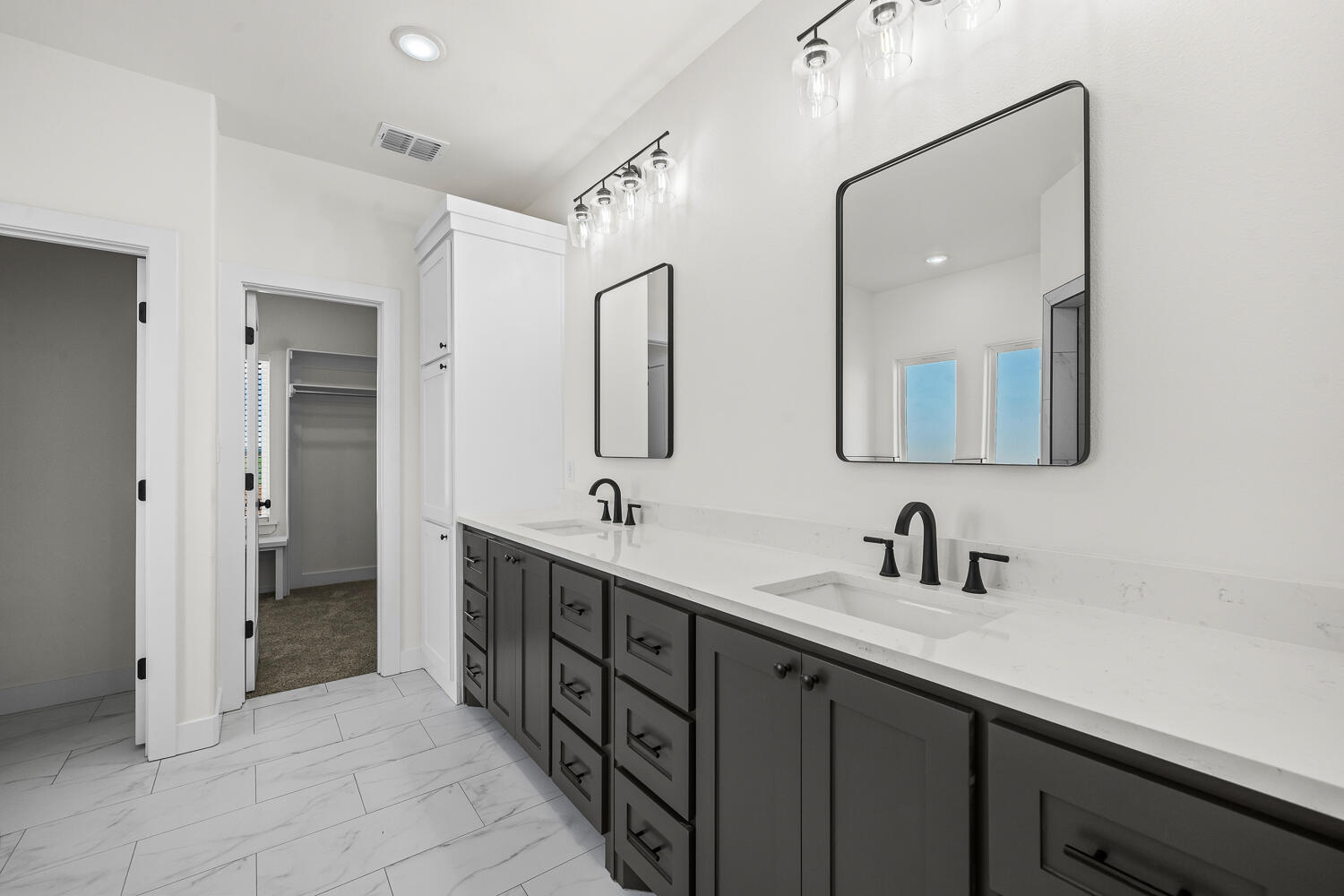 8115 County Road Shallowater, TX 79363 - Photo 8 of 47 a bathroom with a double vanity sink mirror and