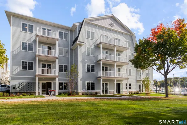 a front view of building with a garden