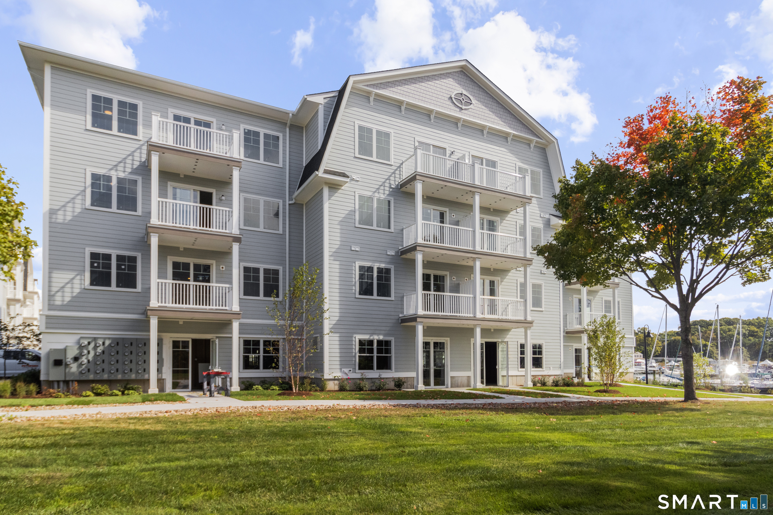 52 Maple Street, Unit 414 Branford, CT 06405 - Photo 12 of 17 a front view of building with a garden