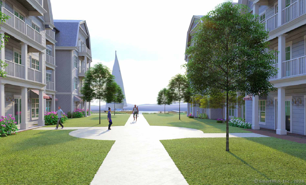 52 Maple Street, Unit 414 Branford, CT 06405 - Photo 4 of 17 a view of a house with a yard and a tree