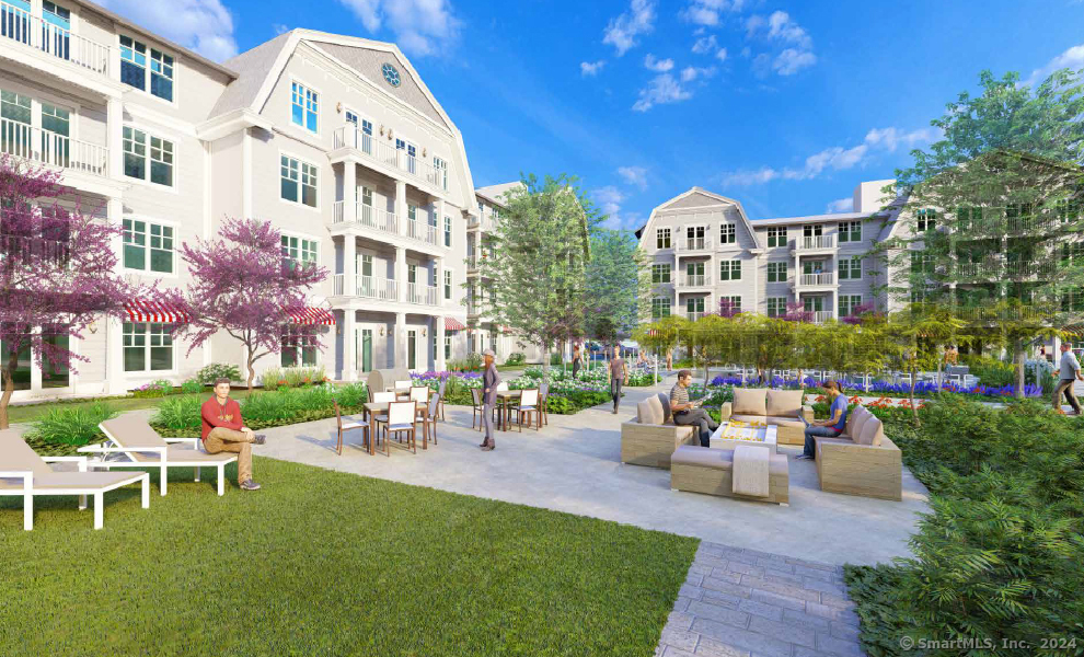 52 Maple Street, Unit 414 Branford, CT 06405 - Photo 8 of 17 a front view of a building with outdoor seating