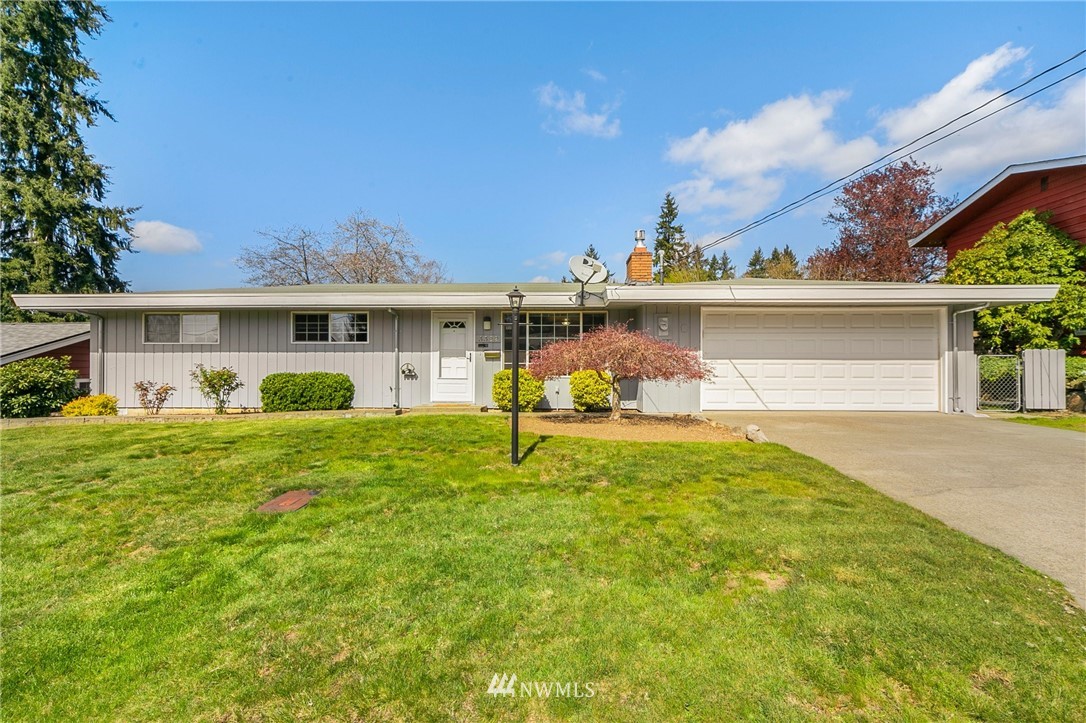 3322 Northeast 10th Place Renton, WA 98056 - Photo 1 of 21 a view of a house with a yard porch and a table and chairs