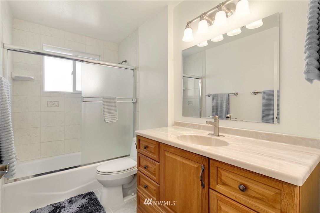 3322 Northeast 10th Place Renton, WA 98056 - Photo 15 of 21 a bathroom with a sink a toilet and shower