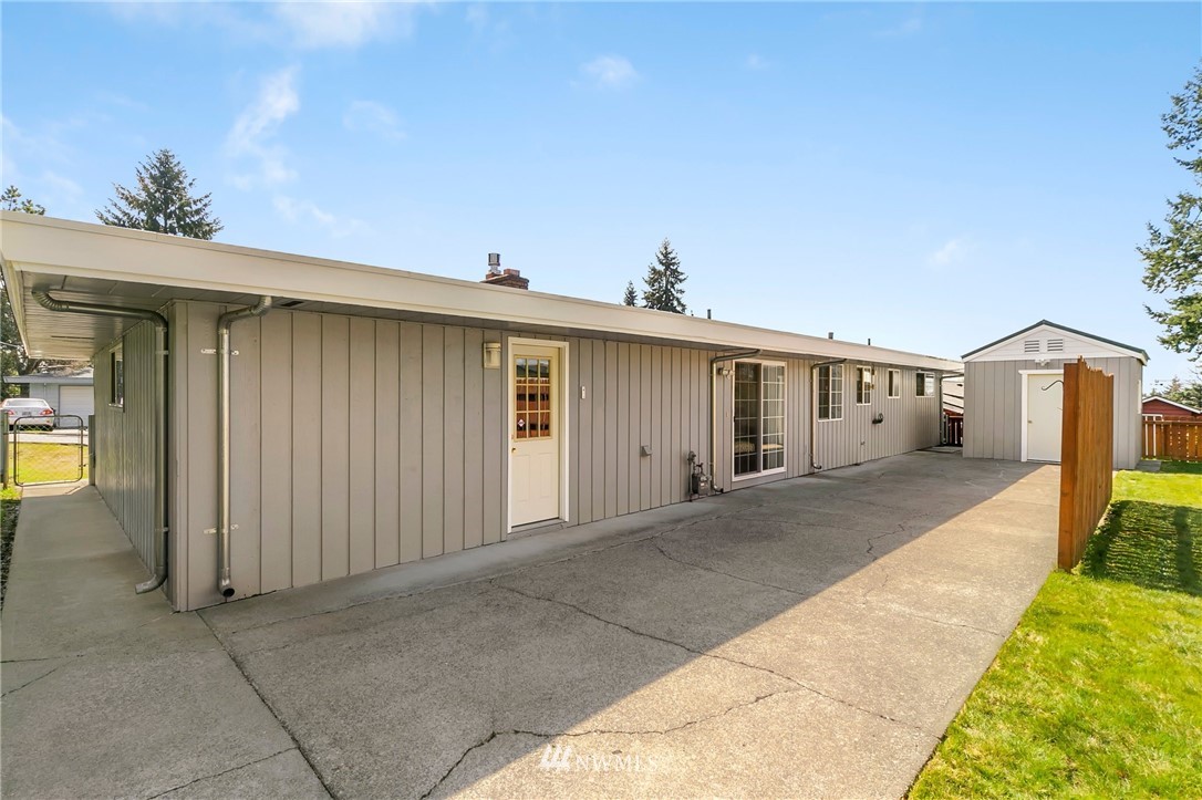 3322 Northeast 10th Place Renton, WA 98056 - Photo 20 of 21 a front view of a house with a yard and garage