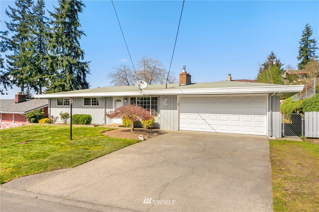 3322 Northeast 10th Place Renton, WA 98056 - Photo 3 of 21 a view of a house with a patio and a yard