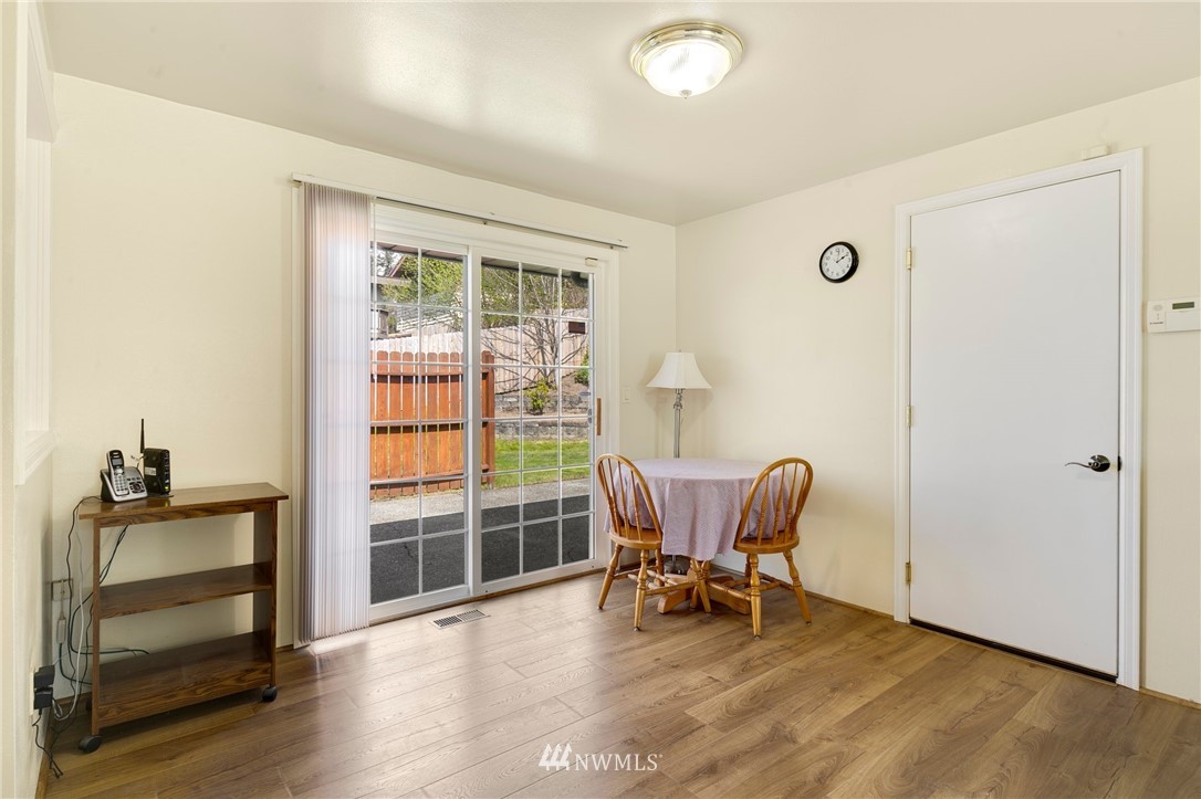 3322 Northeast 10th Place Renton, WA 98056 - Photo 7 of 21 a view of a workspace with furniture and a window