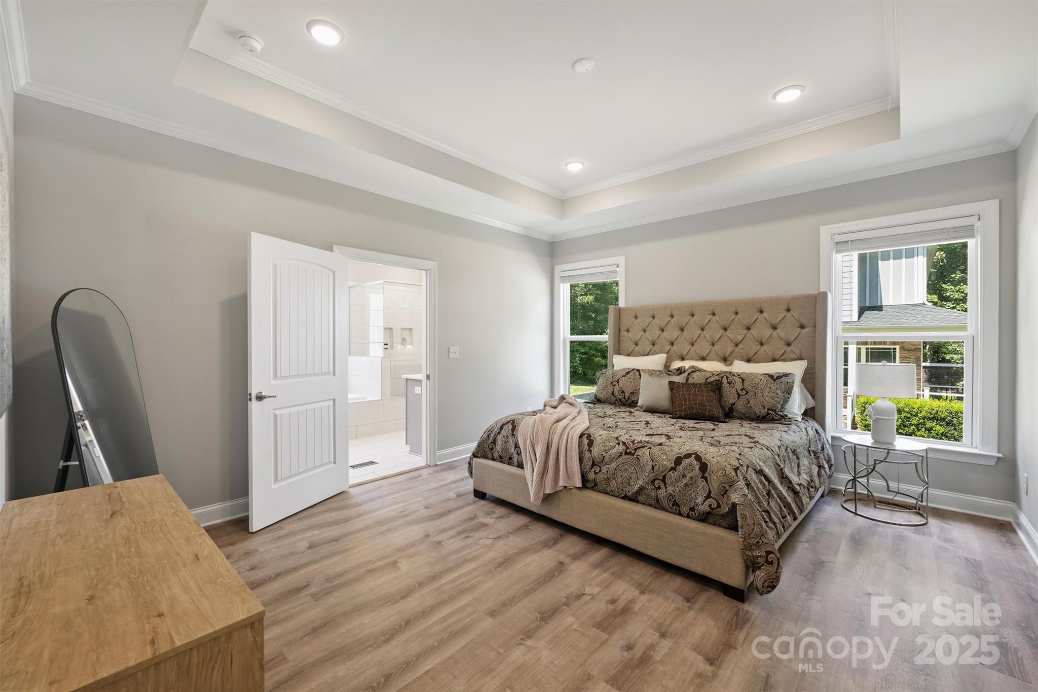 2413 Rocky River Road Charlotte, NC 28213 - Photo 11 of 46 a bedroom with a bed and wooden floor