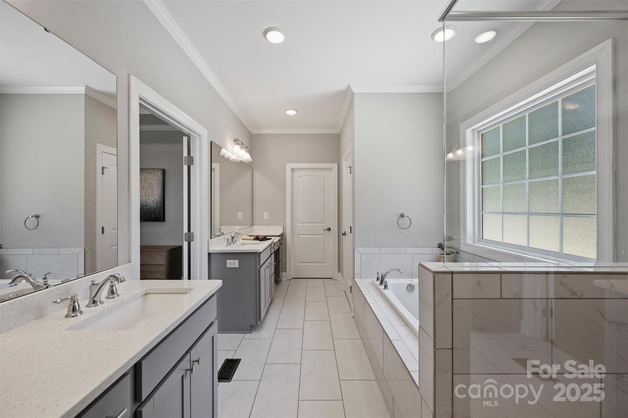 2413 Rocky River Road Charlotte, NC 28213 - Photo 13 of 46 a bathroom with a tub sink and mirror
