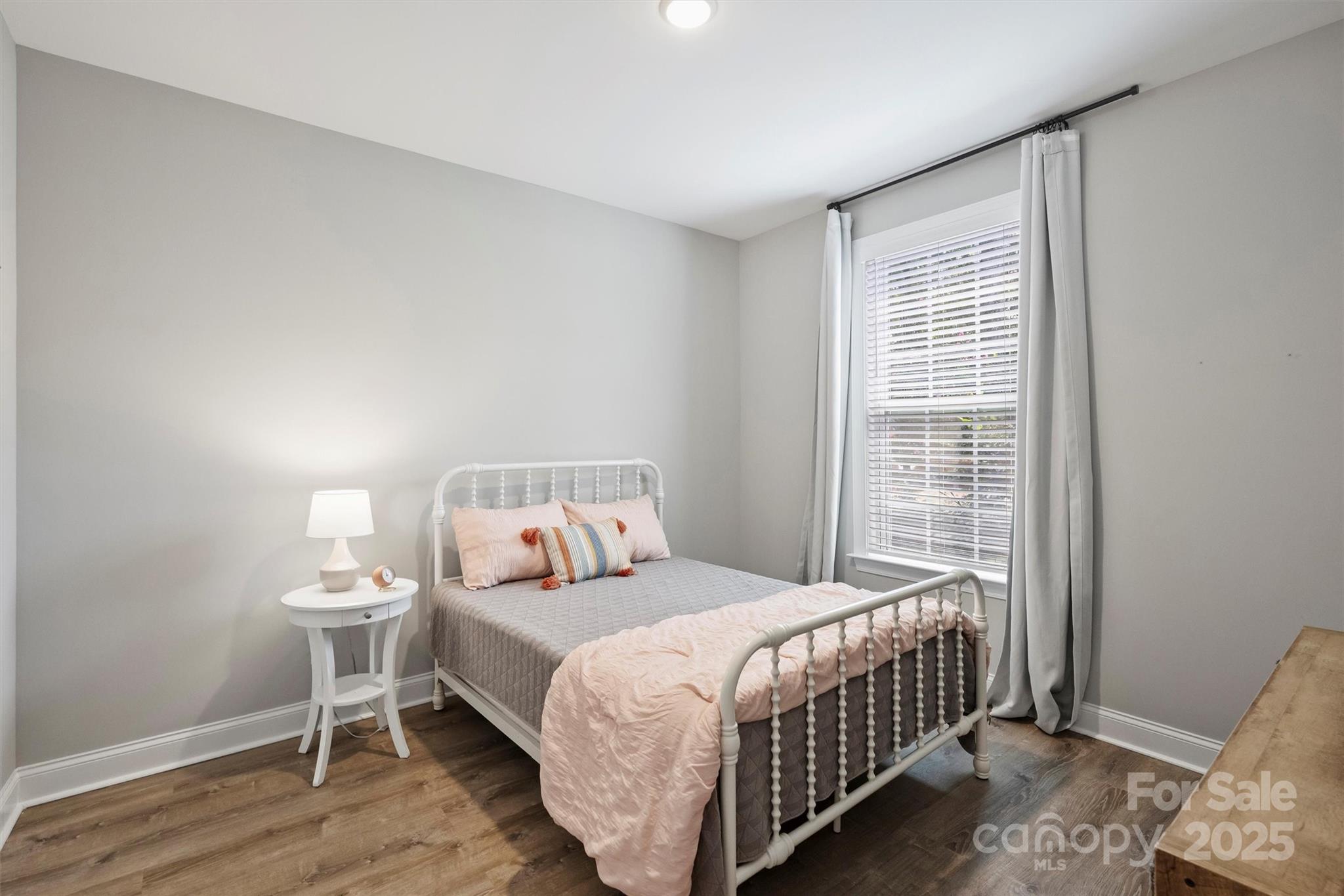 2413 Rocky River Road Charlotte, NC 28213 - Photo 17 of 46 a bedroom with a bed and a window