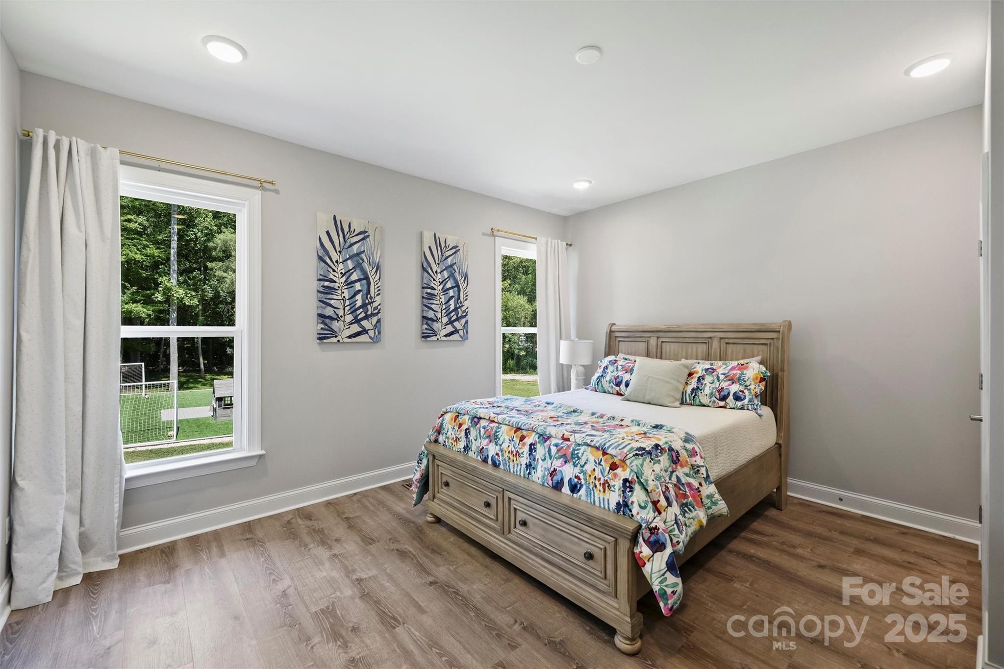 2413 Rocky River Road Charlotte, NC 28213 - Photo 18 of 46 a bedroom with a bed and a window
