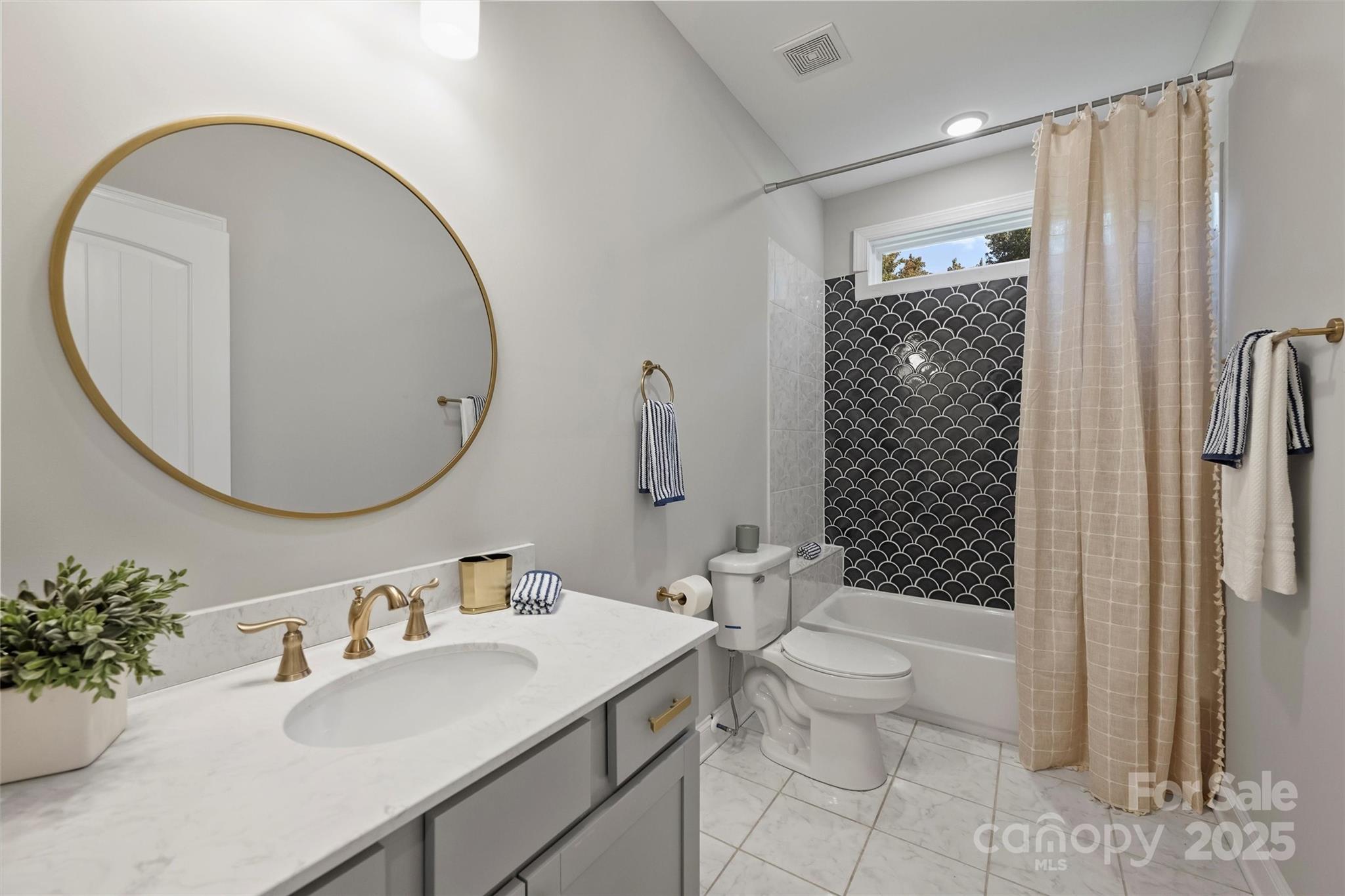 2413 Rocky River Road Charlotte, NC 28213 - Photo 19 of 46 a bathroom with a sink toilet and shower