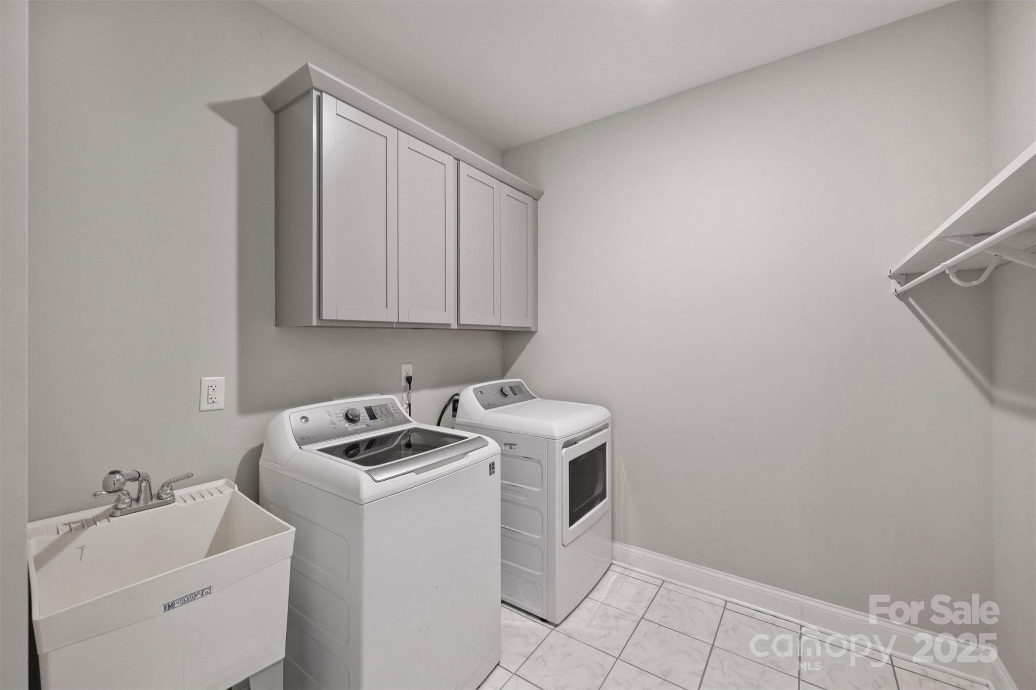 2413 Rocky River Road Charlotte, NC 28213 - Photo 20 of 46 a view of storage and utility room with washer and dryer