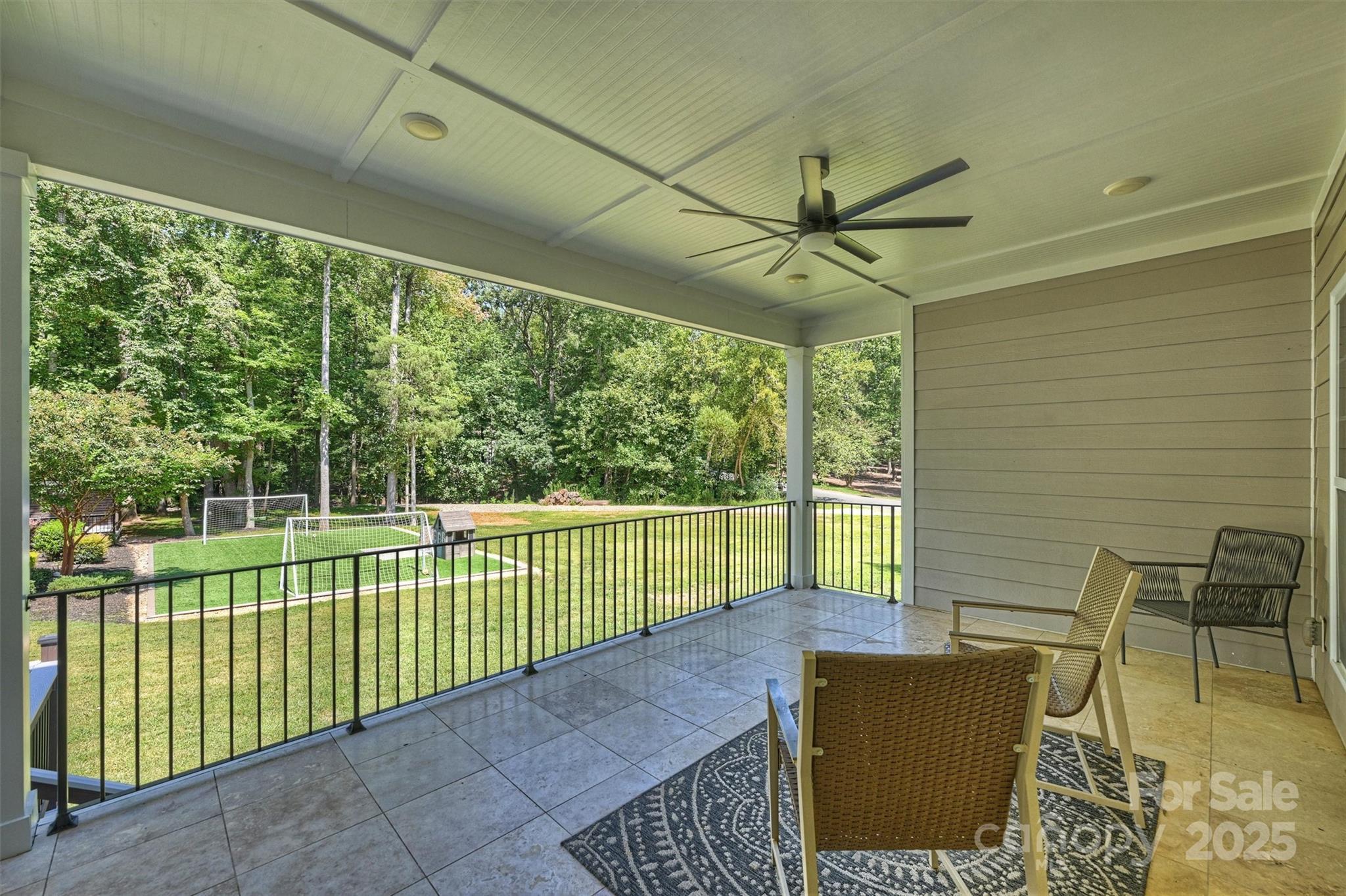 2413 Rocky River Road Charlotte, NC 28213 - Photo 26 of 46 a view of a porch with furniture and floor to ceiling window