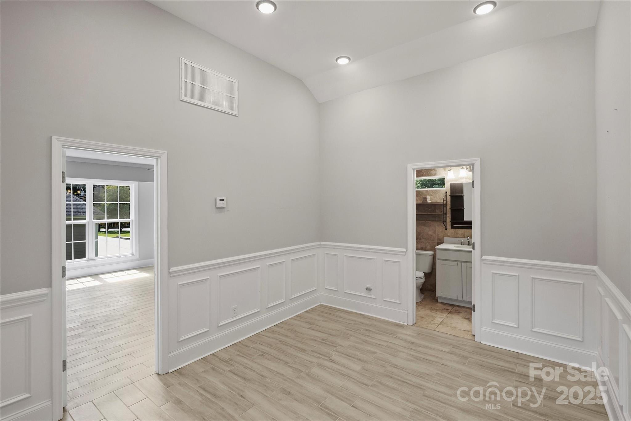 2413 Rocky River Road Charlotte, NC 28213 - Photo 36 of 46 a view of empty room with wooden floor and fan