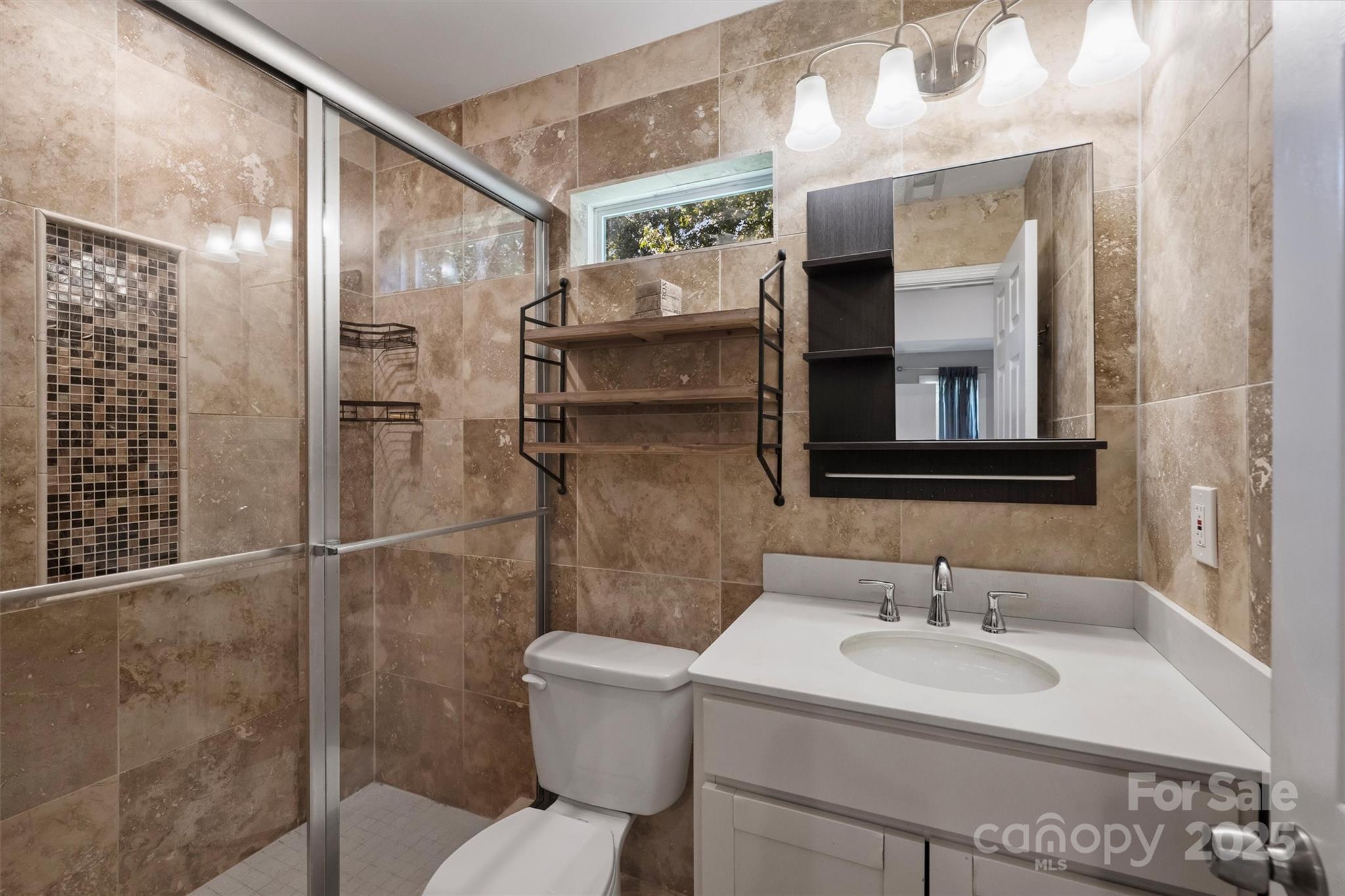 2413 Rocky River Road Charlotte, NC 28213 - Photo 40 of 46 a bathroom with a sink toilet and shower