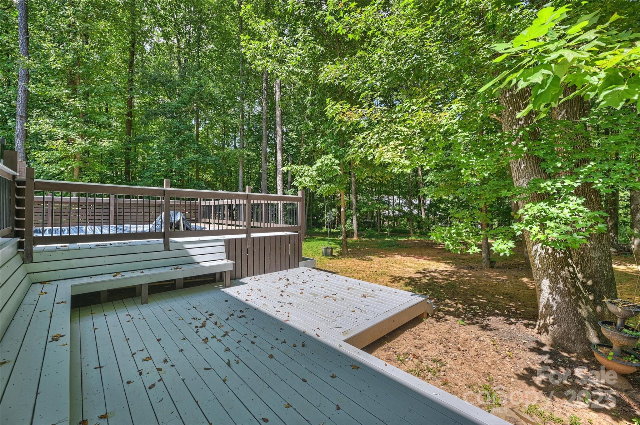 2413 Rocky River Road Charlotte, NC 28213 - Photo 44 of 46 a view of a wooden deck with a bench