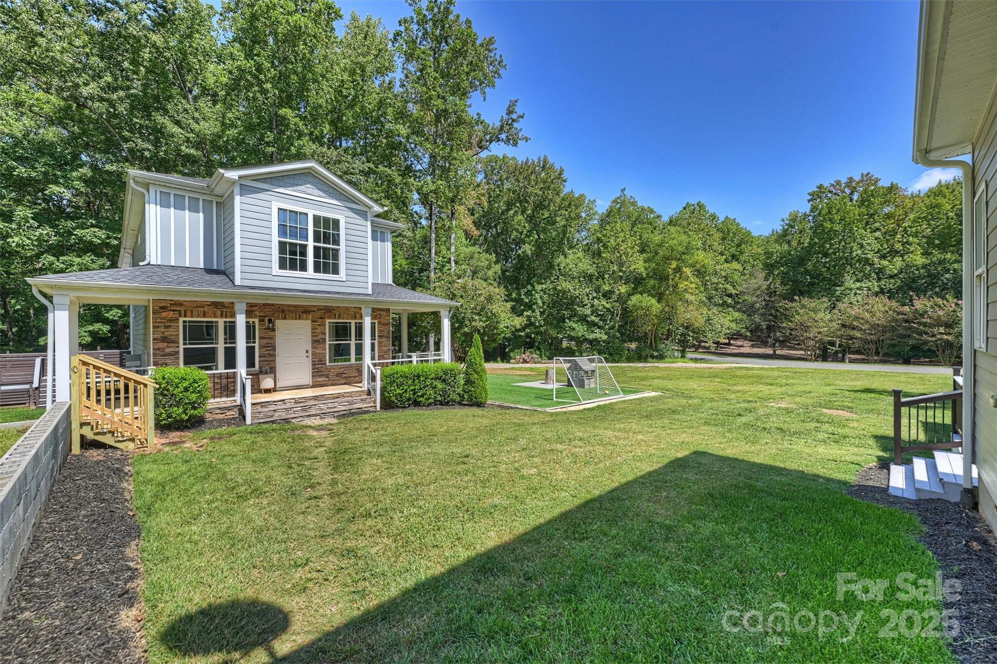 2413 Rocky River Road Charlotte, NC 28213 - Photo 46 of 46 a front view of a house with a yard