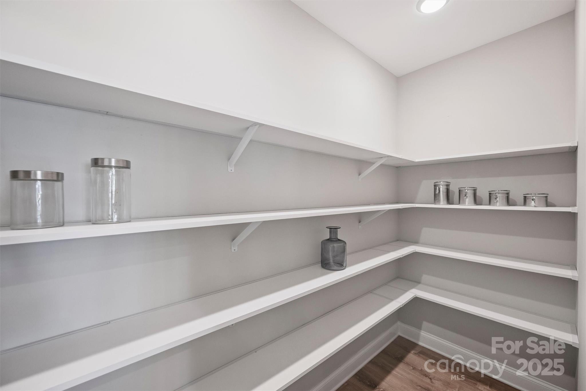 2413 Rocky River Road Charlotte, NC 28213 - Photo 9 of 46 a view of storage and utility room with racks on the wall